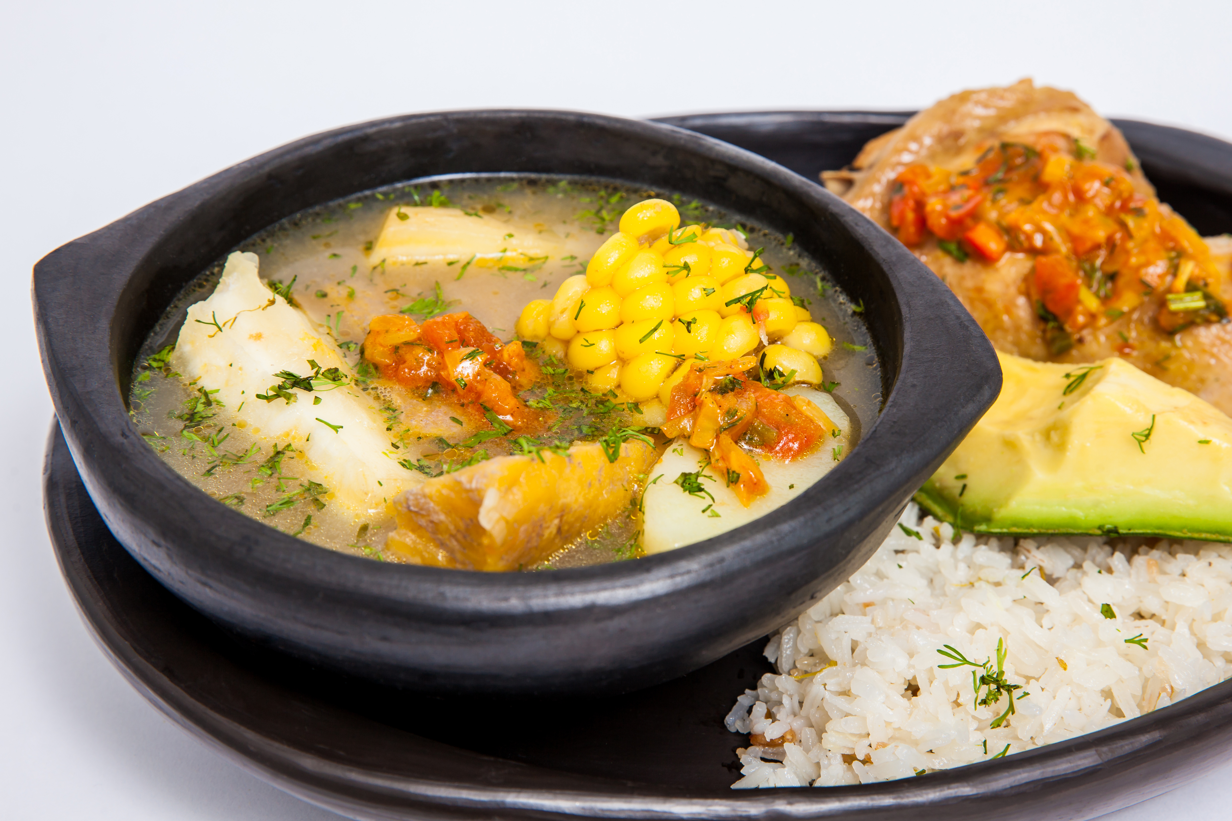 Traditional Colombian soup from the region of Valle del Cauca called sancocho isolated on white background